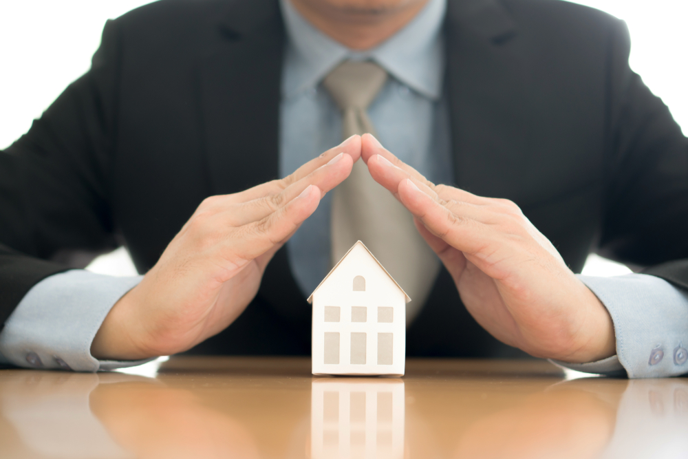 Hands sheltering home